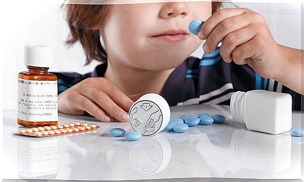 A child is playing with medicine.