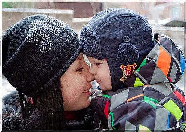 Mother and child rubbing noses