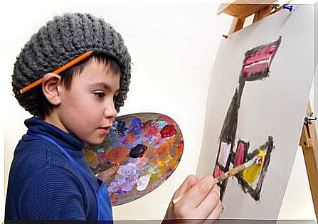 Hobbies for children: A boy who paints a picture. 