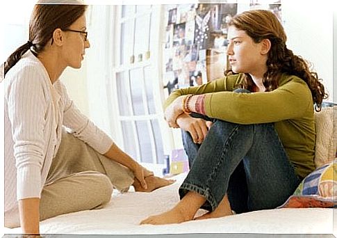 Mother talking to daughter.