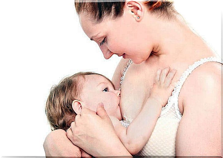 mother breastfeeds children