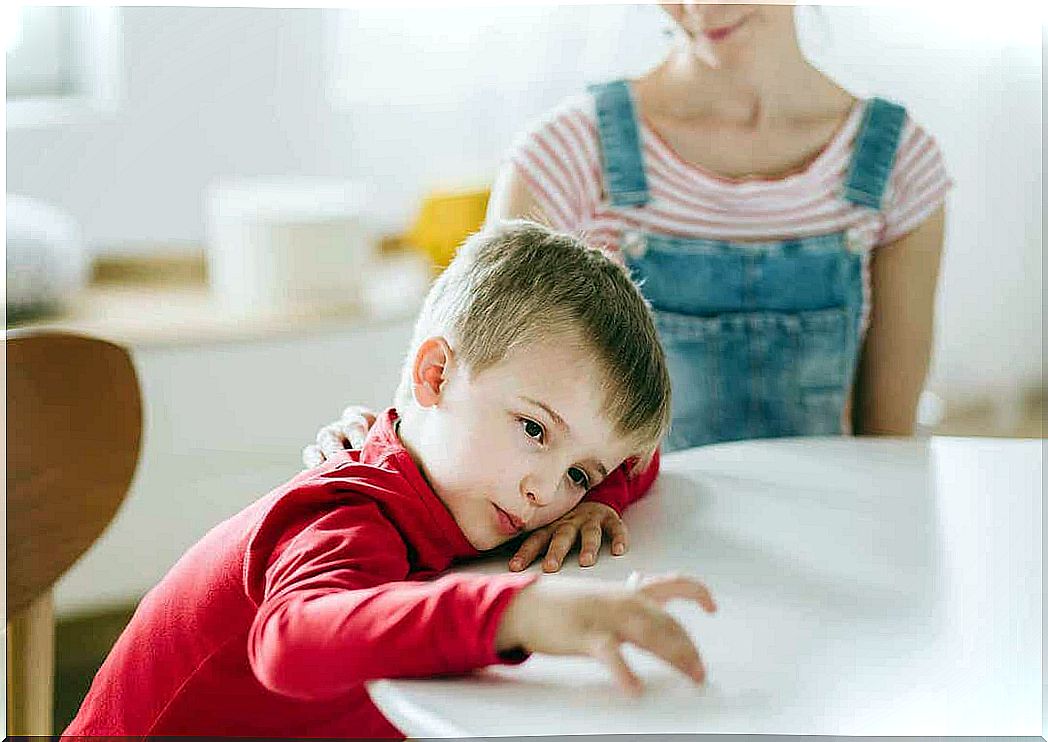 types of attention: bored boy at kitchen table