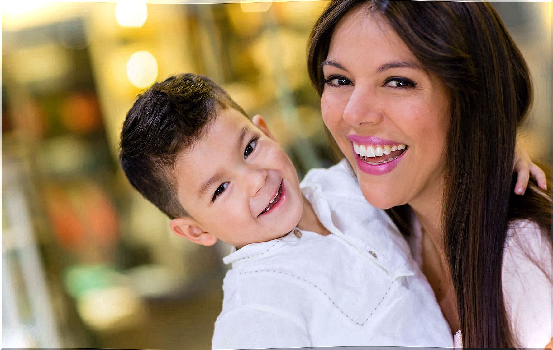 Mom and son smiling