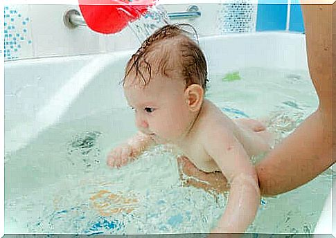 A baby in the bathroom.