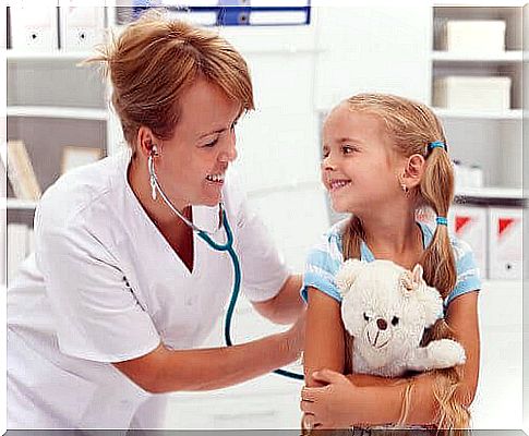 Children hold their teddy bear during a visit to the doctor.