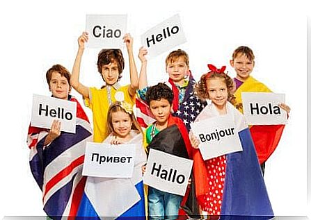 most spoken languages: children with flags and signs with different languages