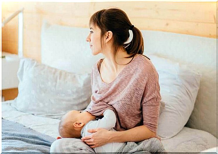 woman breastfeeding baby