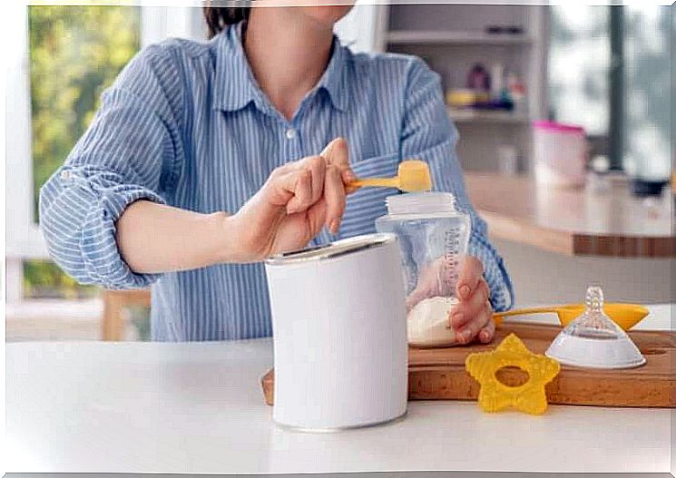 woman preparing infant formula