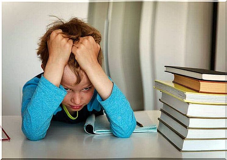 dynamic thinking: frustrated boy at pile of books