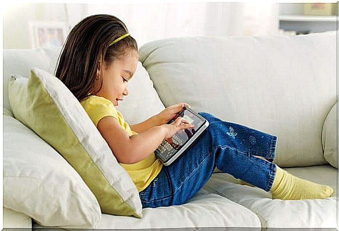 girl on sofa with tablet