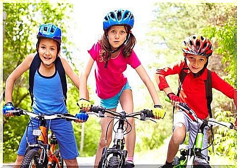 three children on bicycles