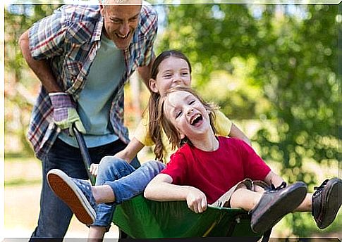 Children ride wheelbarrows