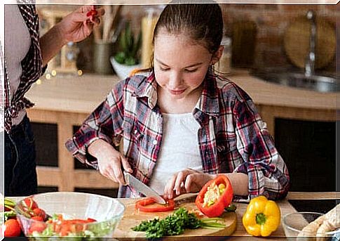 Teenager is vegan and cuts vegetables