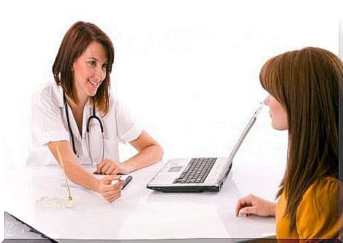 Woman talking to medical staff