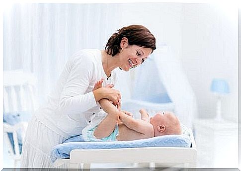 baby on changing table