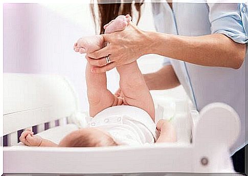 baby on changing table