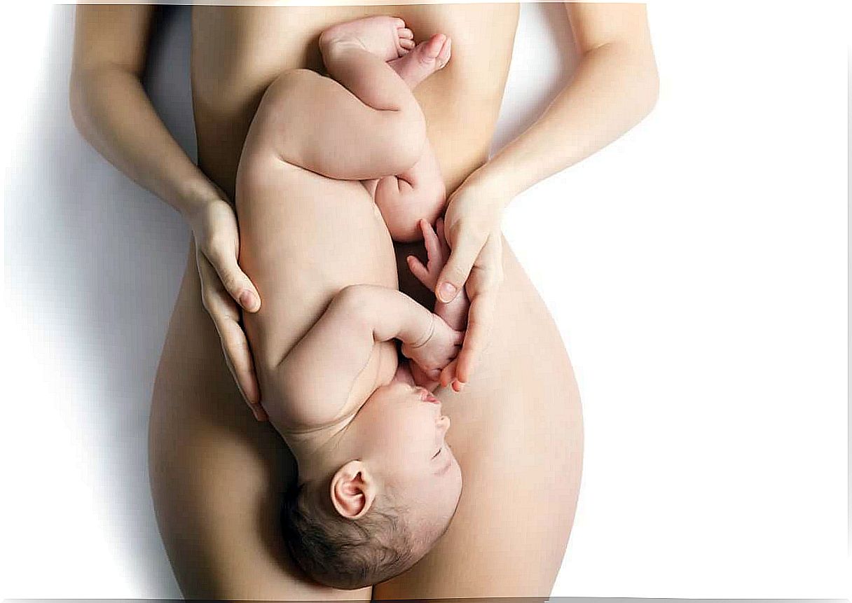 A woman lying on her back with her baby over her belly.