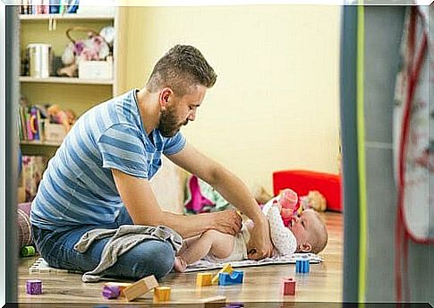 dad playing with baby