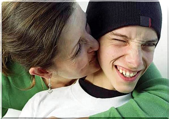 Strength of will: mother kisses teenager on the cheek