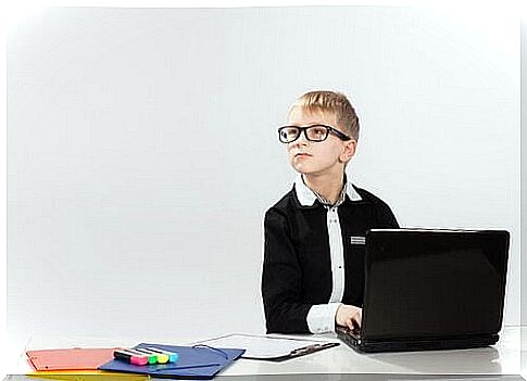 A gifted child is sitting at the computer.