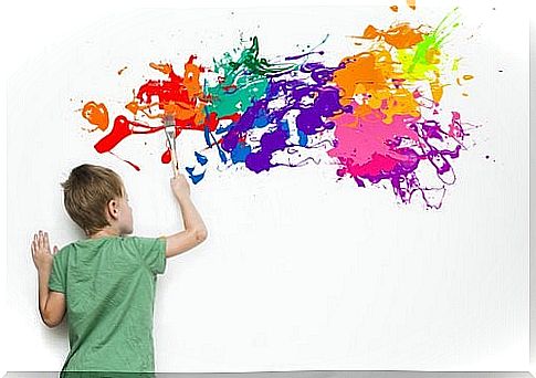 A gifted child paints on the wall.