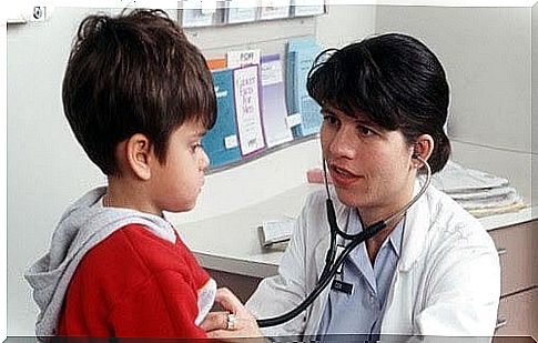 doctor examines boy