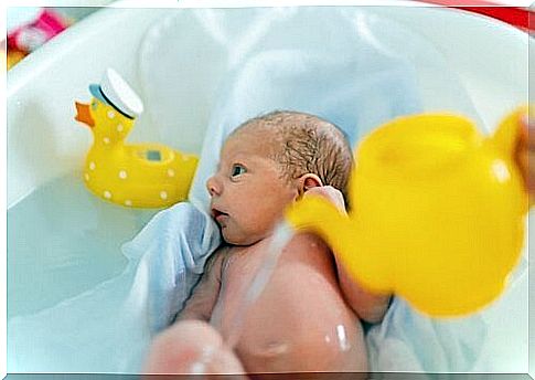 A baby in the bathroom.