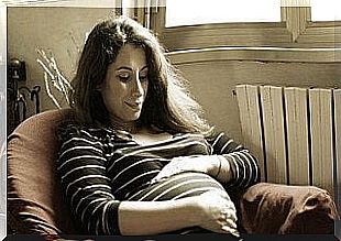 Sitting pregnant woman