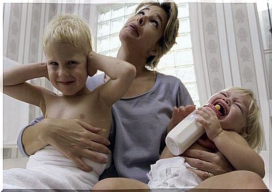 stressed mother with two toddlers