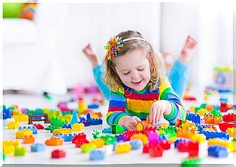 girl playing with lego